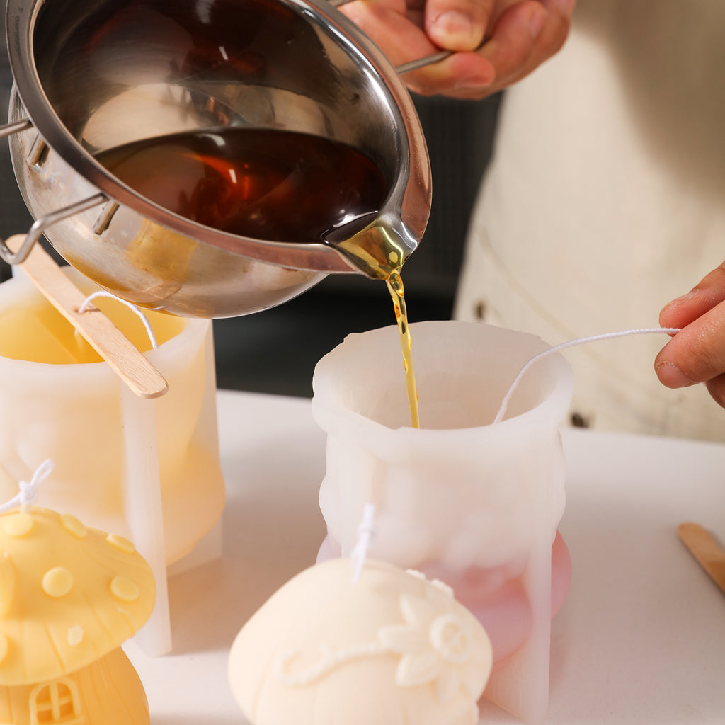 Pour liquid wax into silicone molds to create mushroom house candles, designed by Boowan Nicole.