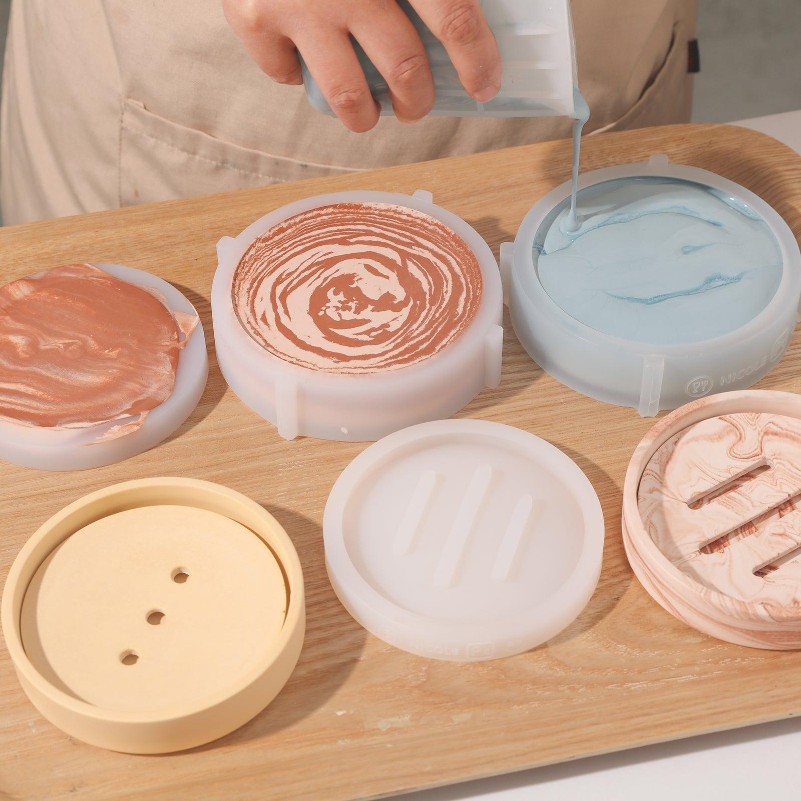 Demonstrates the use of silicone molds to create a soap drain pan.
