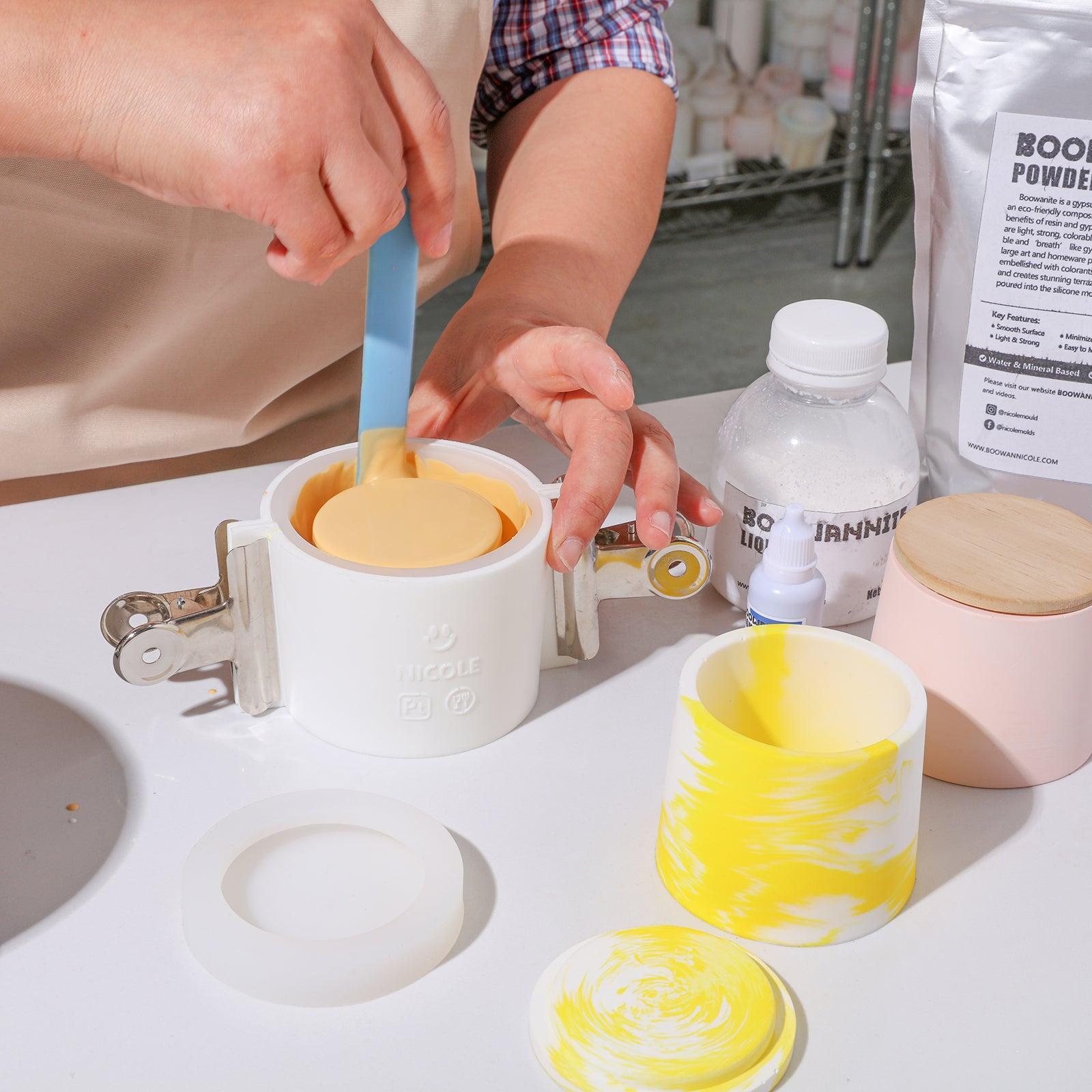 Use tool to expel air bubbles from boowannite material in silicone mold for making Simple Style Small Candle Jar - Boowan Nicole