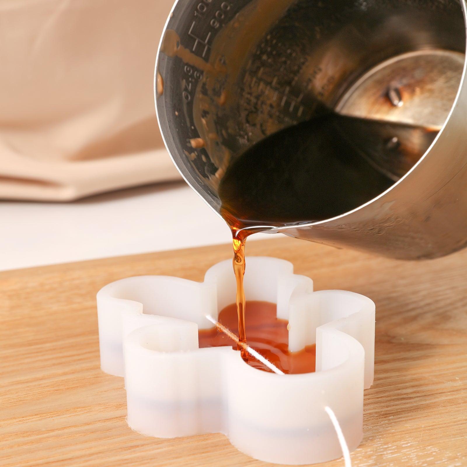 Pour wax liquid into silicone mold to make Gingerbread Mama Candle-Boowan Nicole