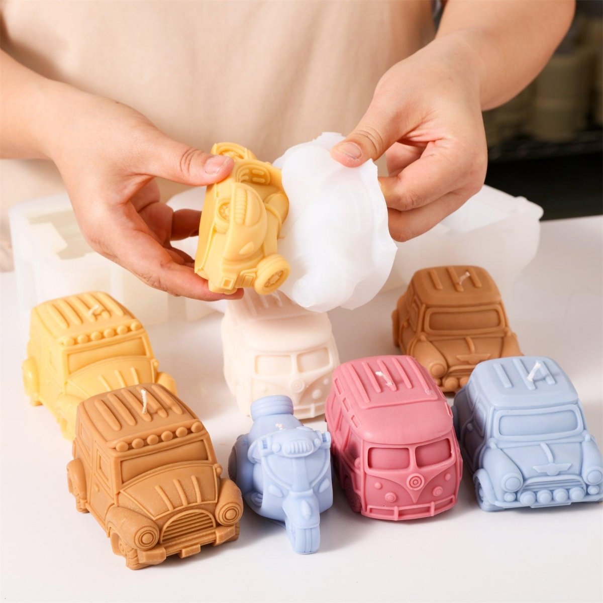 Motorcycle-shaped candles emerge from silicone molds, designed by Boowan Nicole.