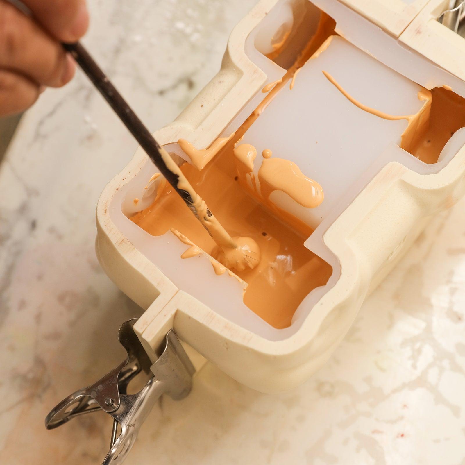 Use a brush to remove air bubbles from silicone molds for making Vintage Off-Road Car Plant Pot Concrete - Boowan Nicole