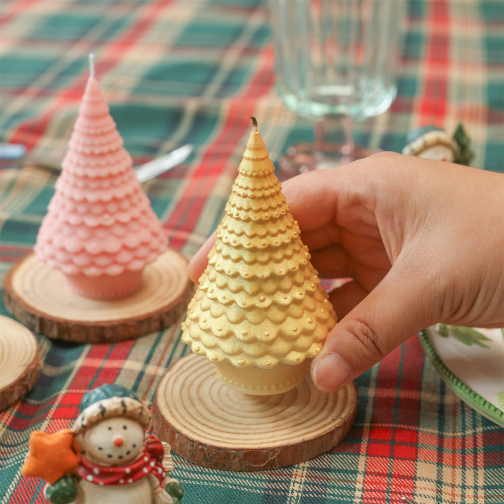 Gold Christmas tree candle placed on a wooden tray - Boowan Nicole