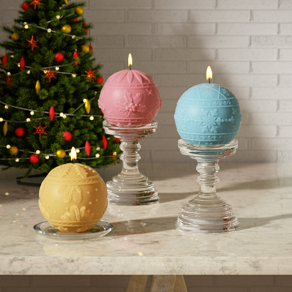 Festive Christmas ball candles with 3D snowflake and holly leaf designs displayed on glass candle holders