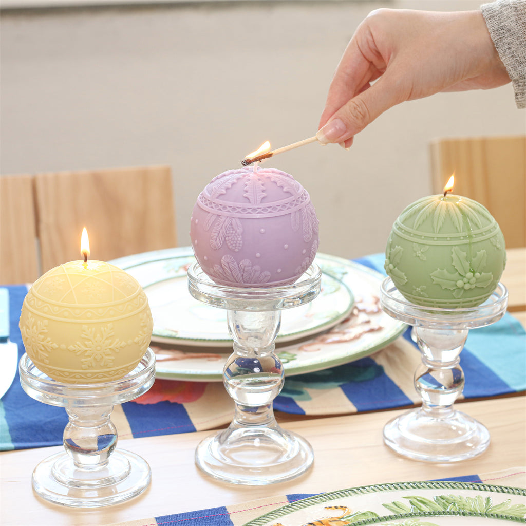 Lighting the Christmas embossed candles on the dining table