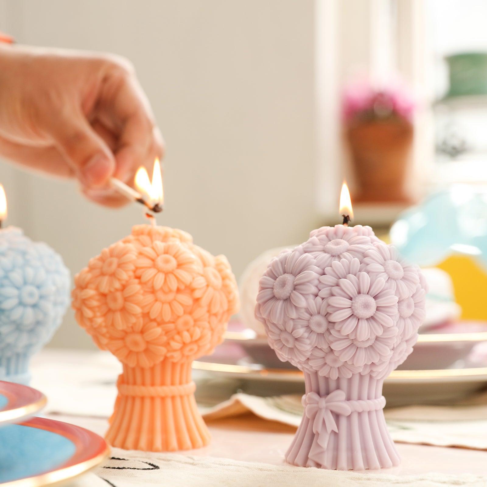 Light Daisy Bouquet Flourishing Candle in Orange and Purple on the Table - Boowan Nicole