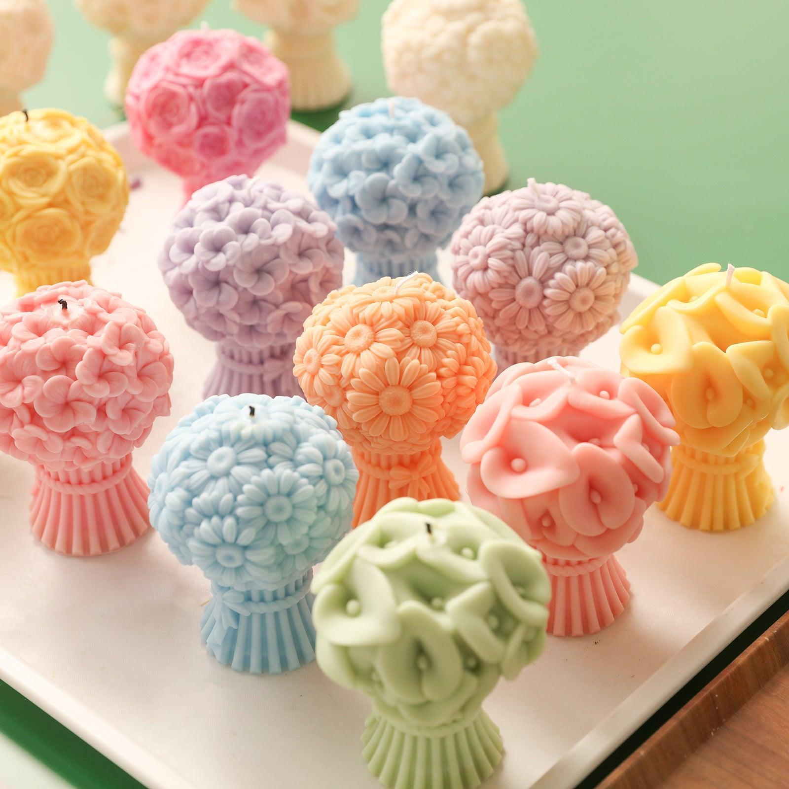 Flourishing Candle-Boowan Nicole in different colors and shapes on the table