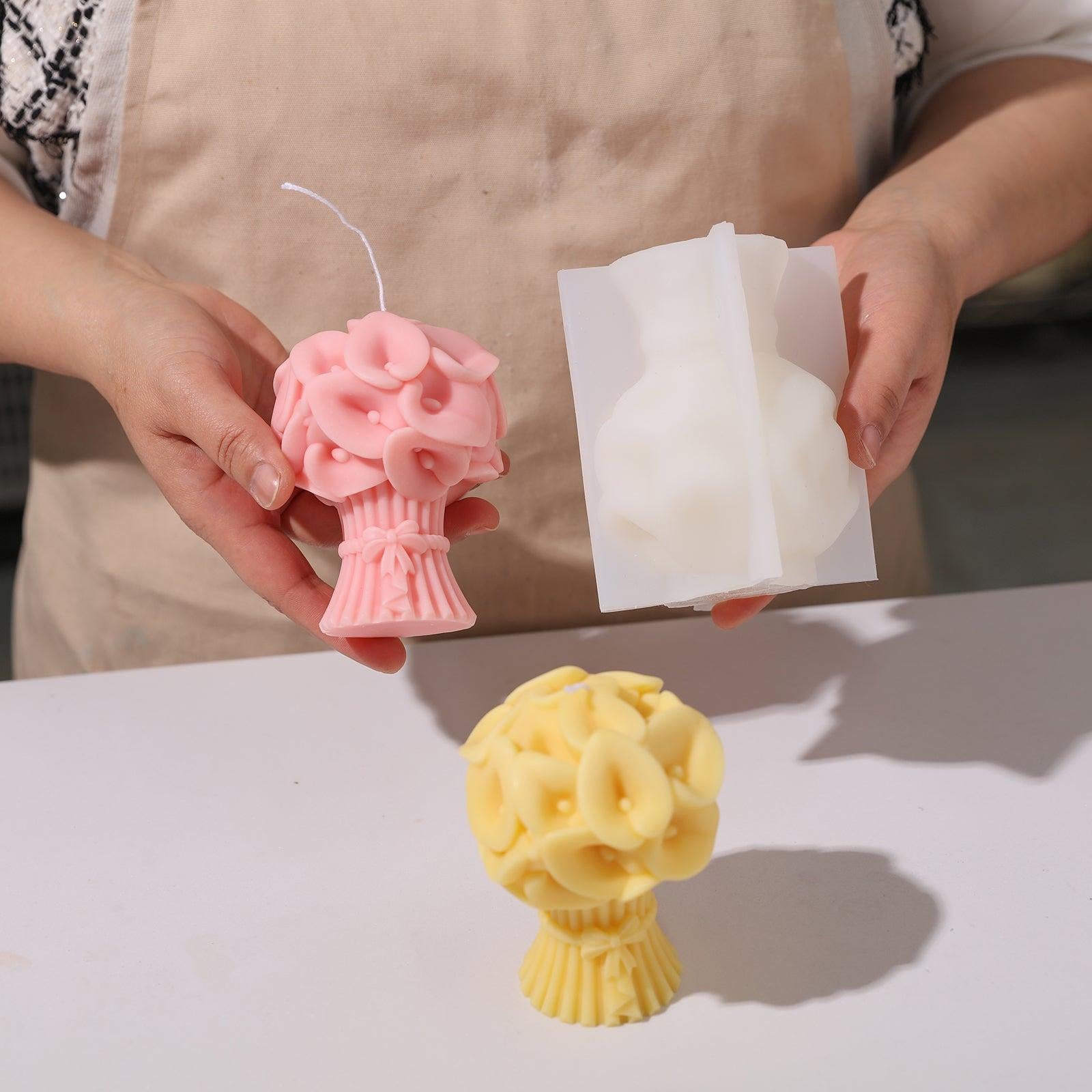 Hand-held display of pink Calla Lily Bouquet Flourishing Candle and white silicone mold -Boowan Nicole