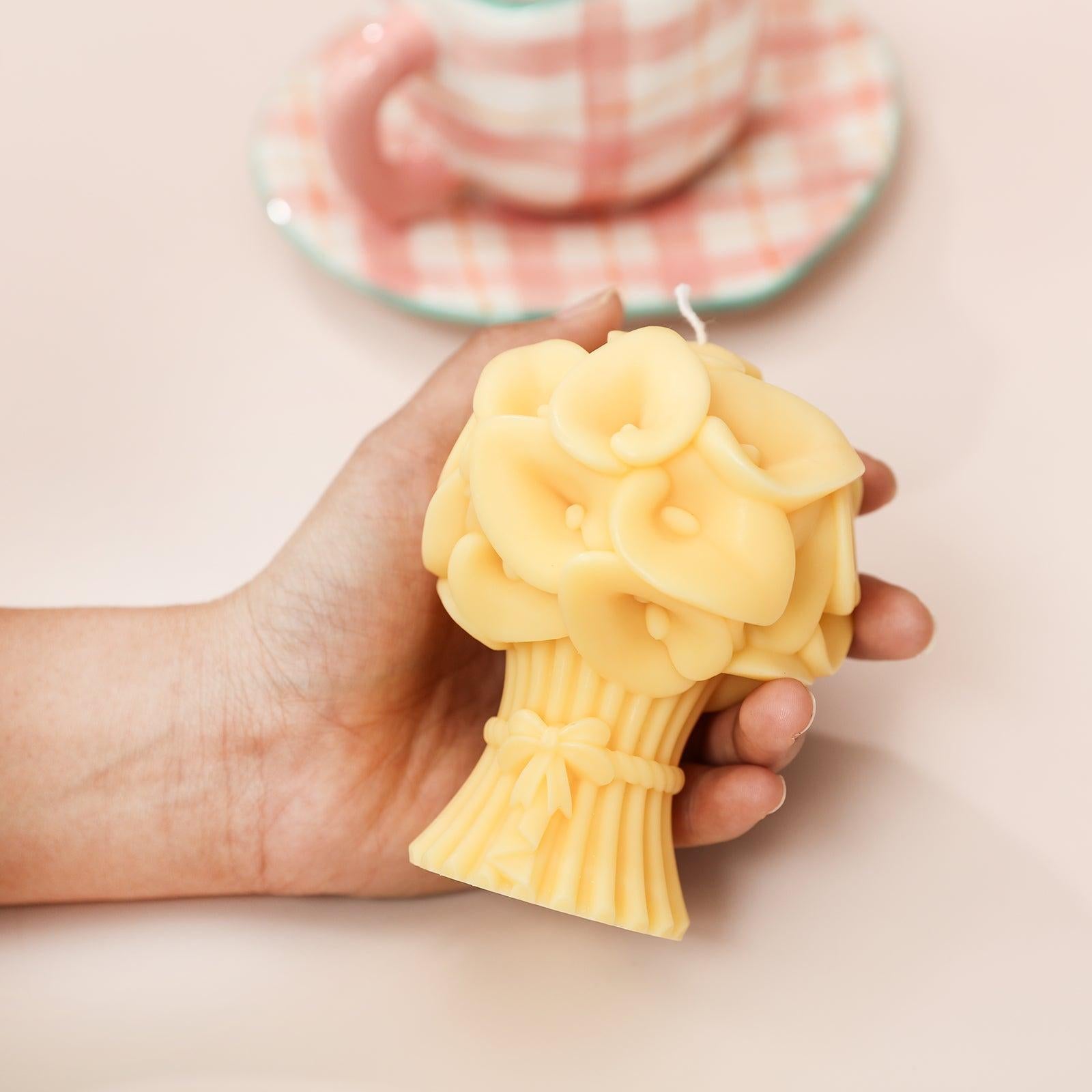 Video of holding yellow Calla Lily Bouquet Flourishing Candle in hand -Boowan Nicole