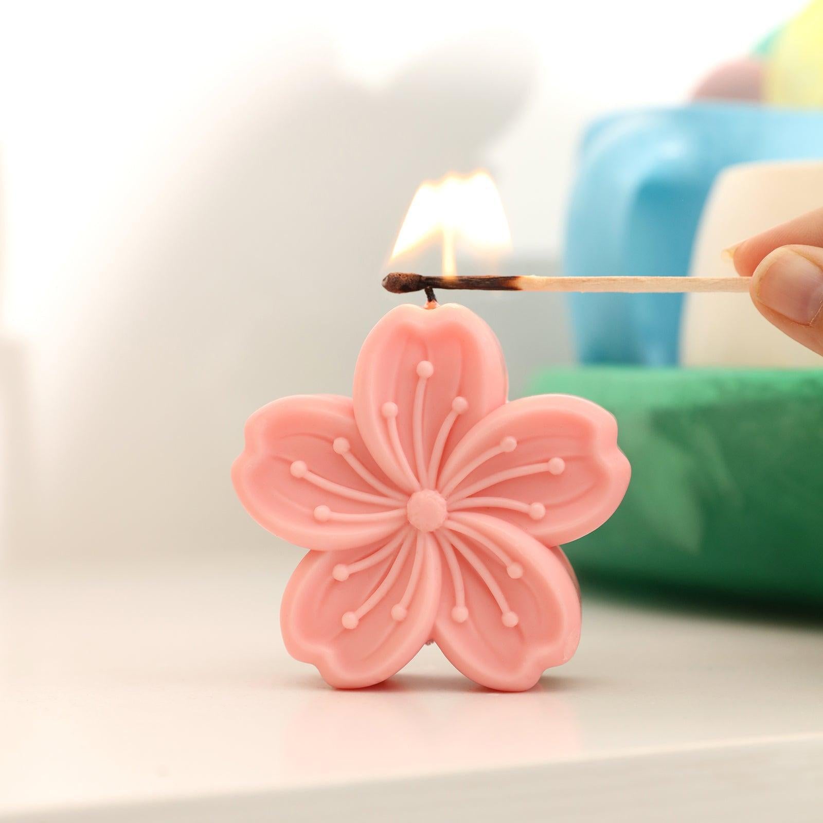 Light up the pink Sakura Candle on the table - Boowan Nicole