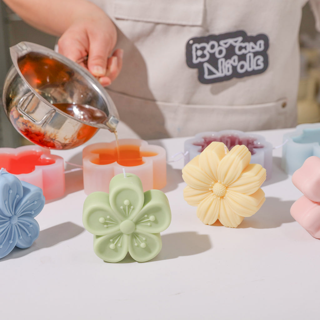Pour liquid wax into silicone mold to make floral candle-Boowan Nicole
