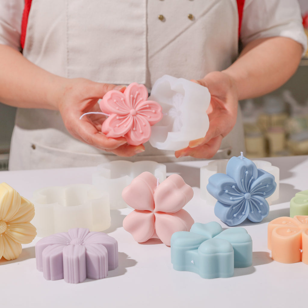 Holding floral candle and white silicone mold for presentation-Boowan Nicole