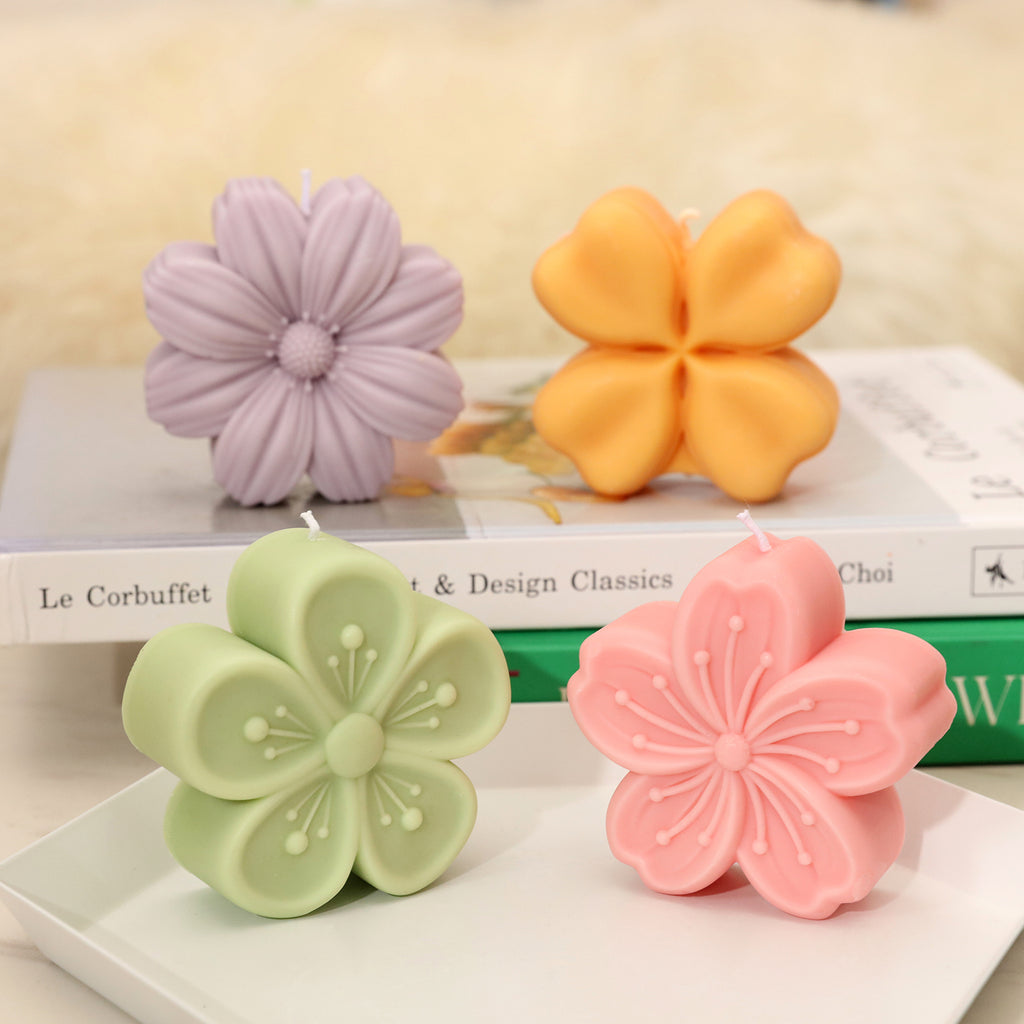 Floral candle-Boowan Nicole in four different shapes, green, pink, yellow and purple