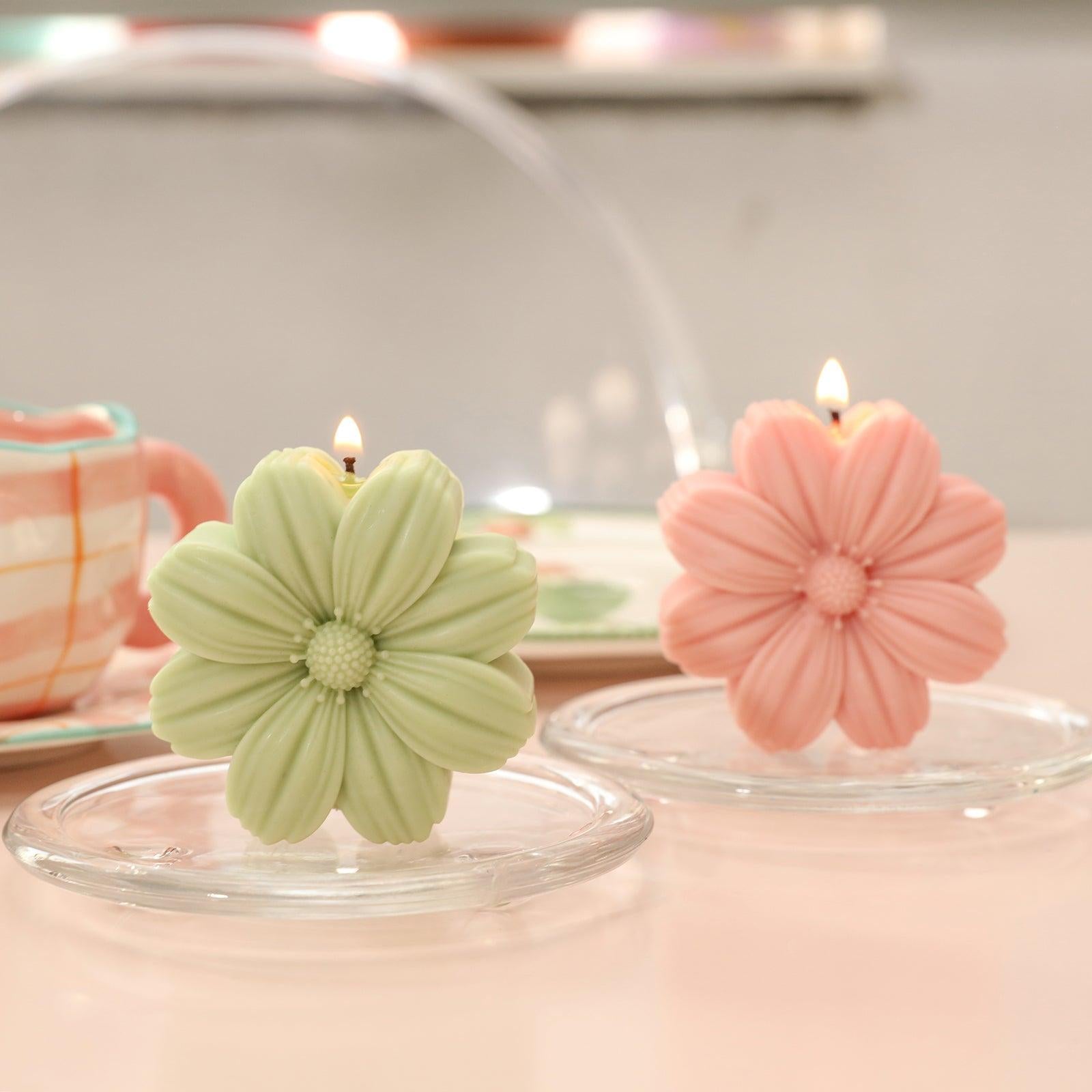 Green and pink Cosmos candle being lit in crystal tray - Boowan Nicole