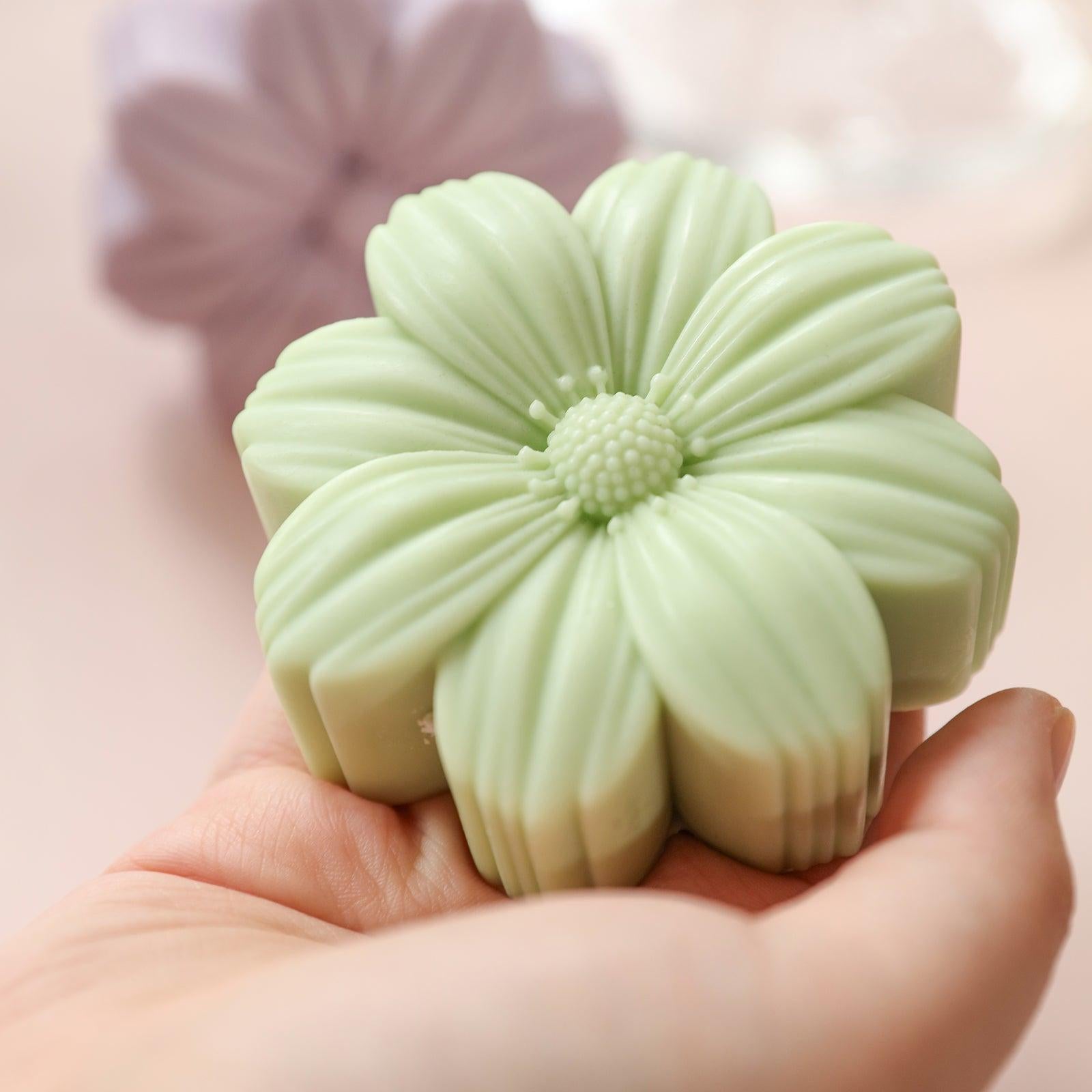 Holding display green Cosmos candle-Boowan Nicole