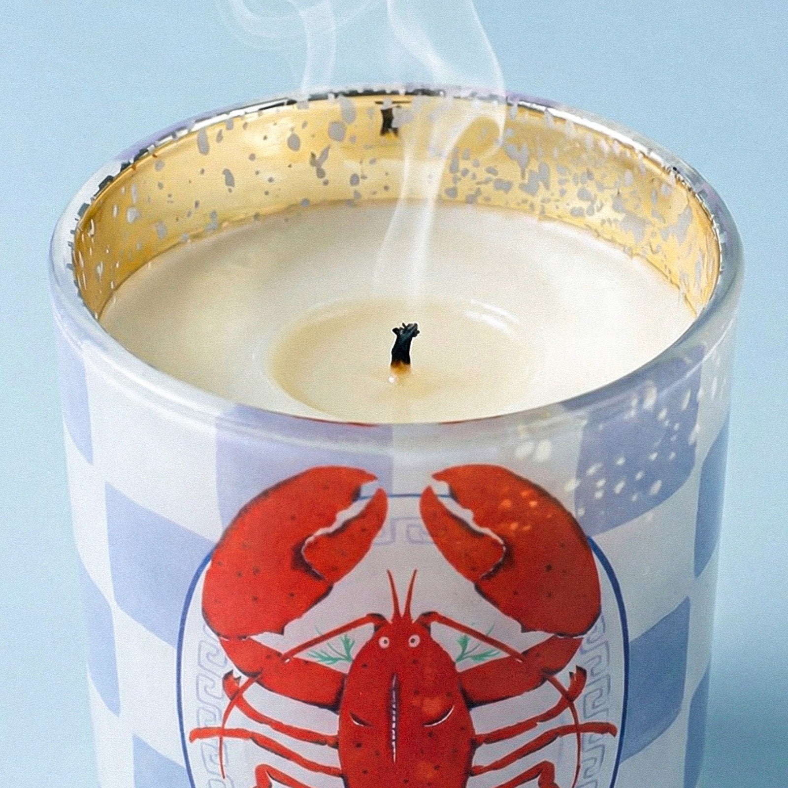 Close-up of Smoldered Wick on Blue Grid Lobster Graphic Gold Rim Glass Candle Vessel - Boowan Nicole