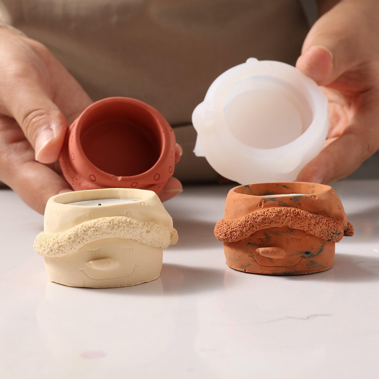 Hand displaying brown Christmas snowman tea light candle holder and white silicone mold - Boowan Nicole