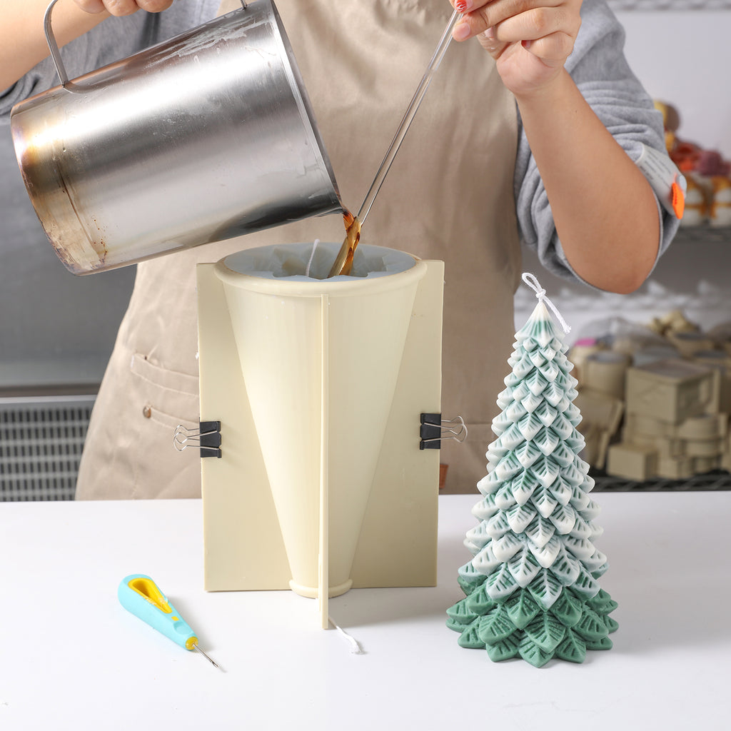 Pour liquid wax into silicone molds for making 8.5-inch Christmas tree candles - Boowan Nicole
