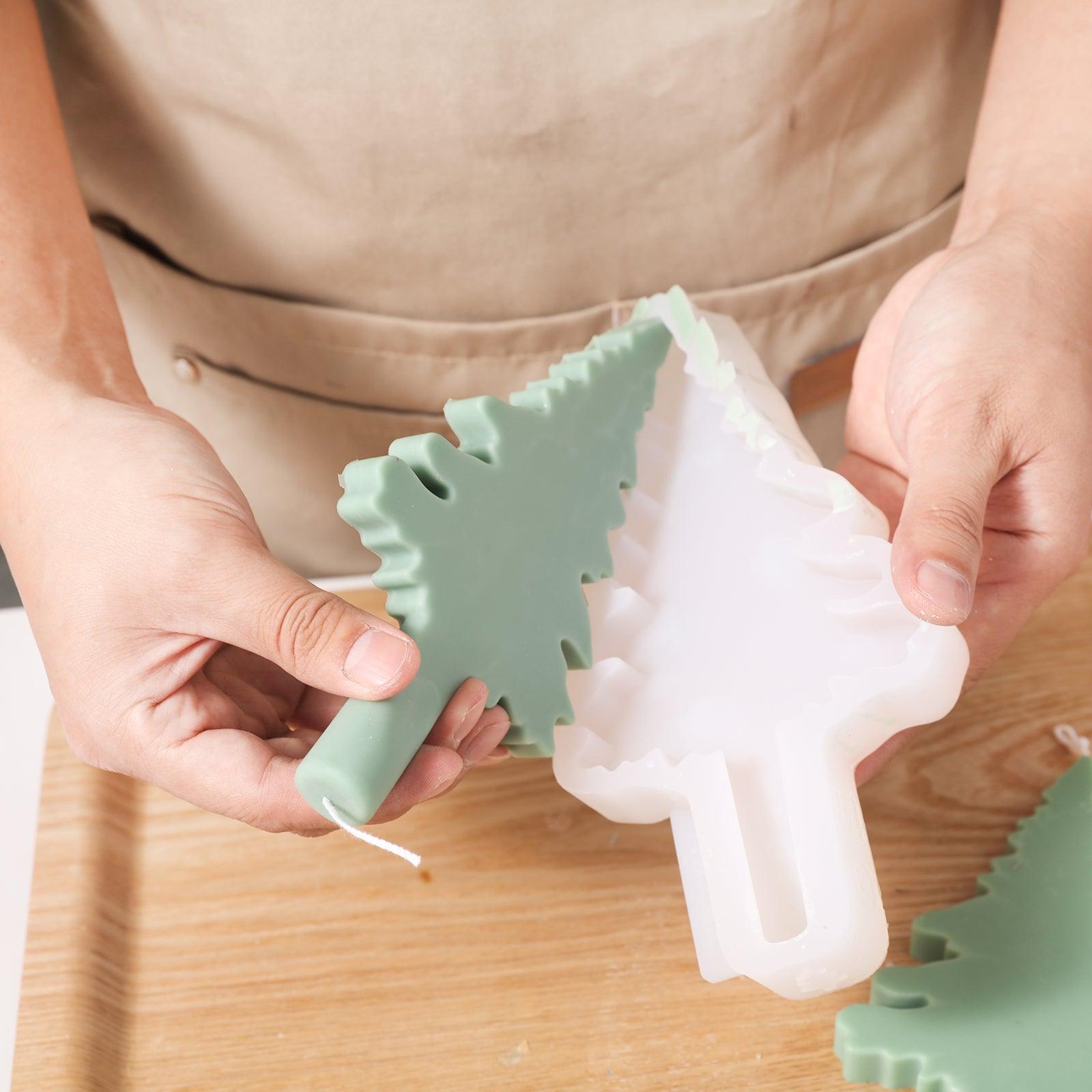 The finished Christmas candle comes out of the silicone mold.