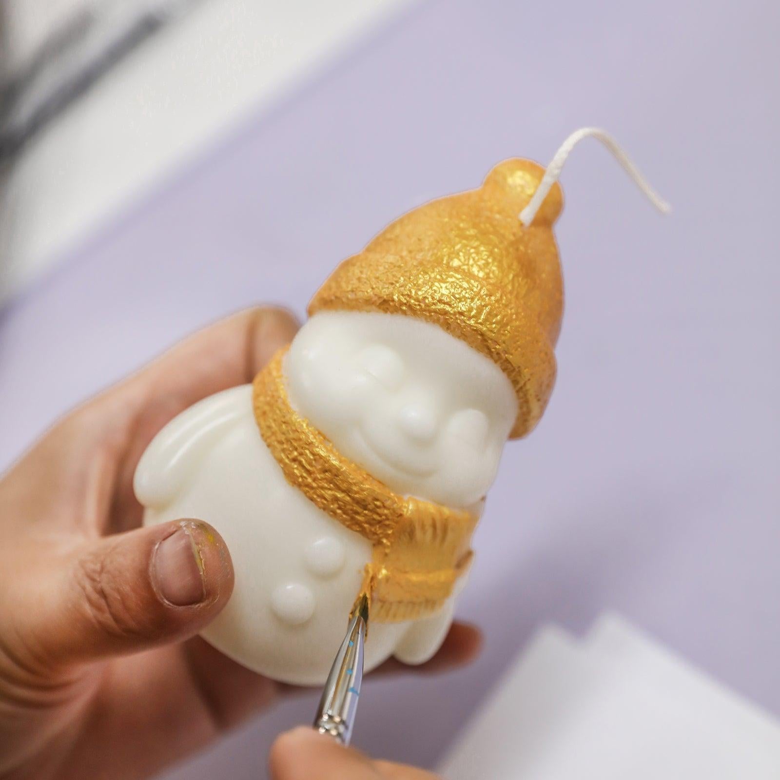 Brush gold mica dust on Smiling Snowy Friends Candle's hat and scarf -Boowan Nicole