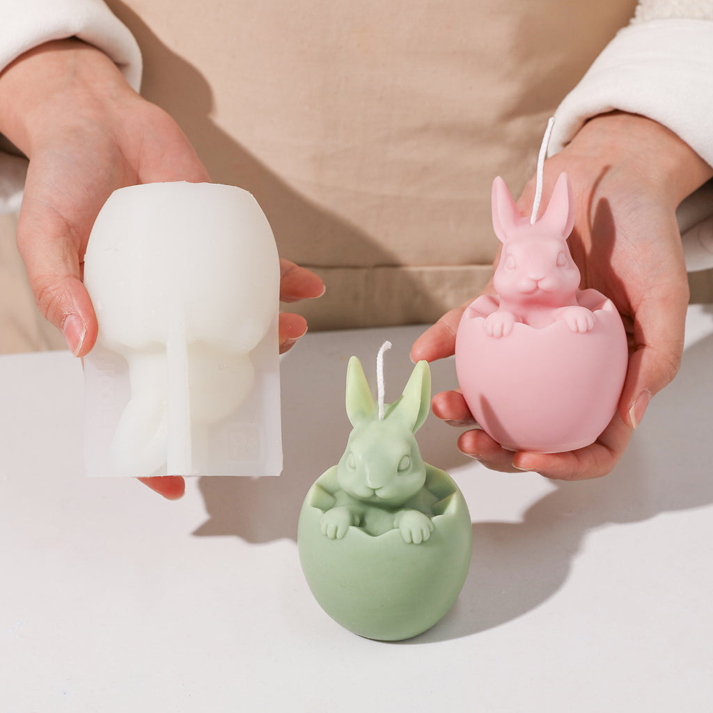 Demonstration of making Easter bunny candles with molds in hands and silicone molds