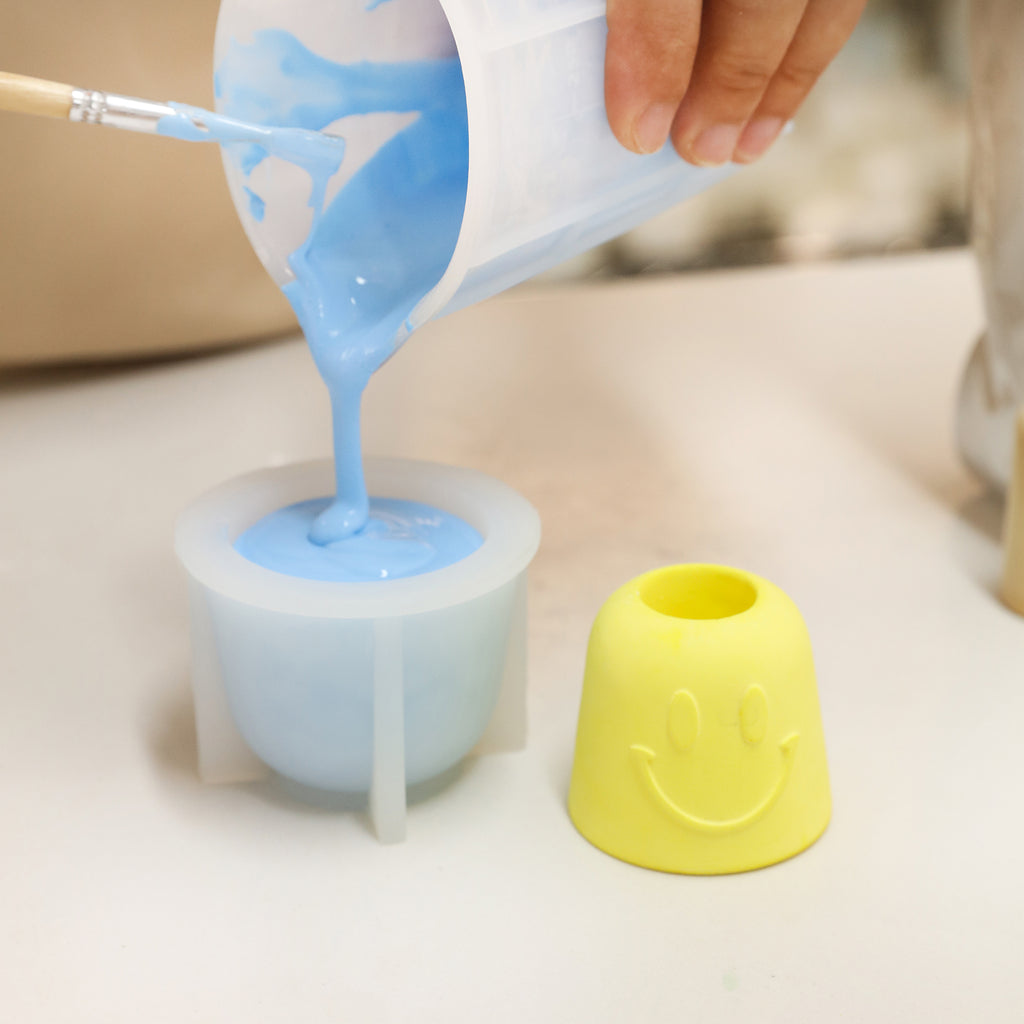 Pour boowannite material into silicone mold to make Smiley Pen & Toothbrush Holder-Boowan Nicole
