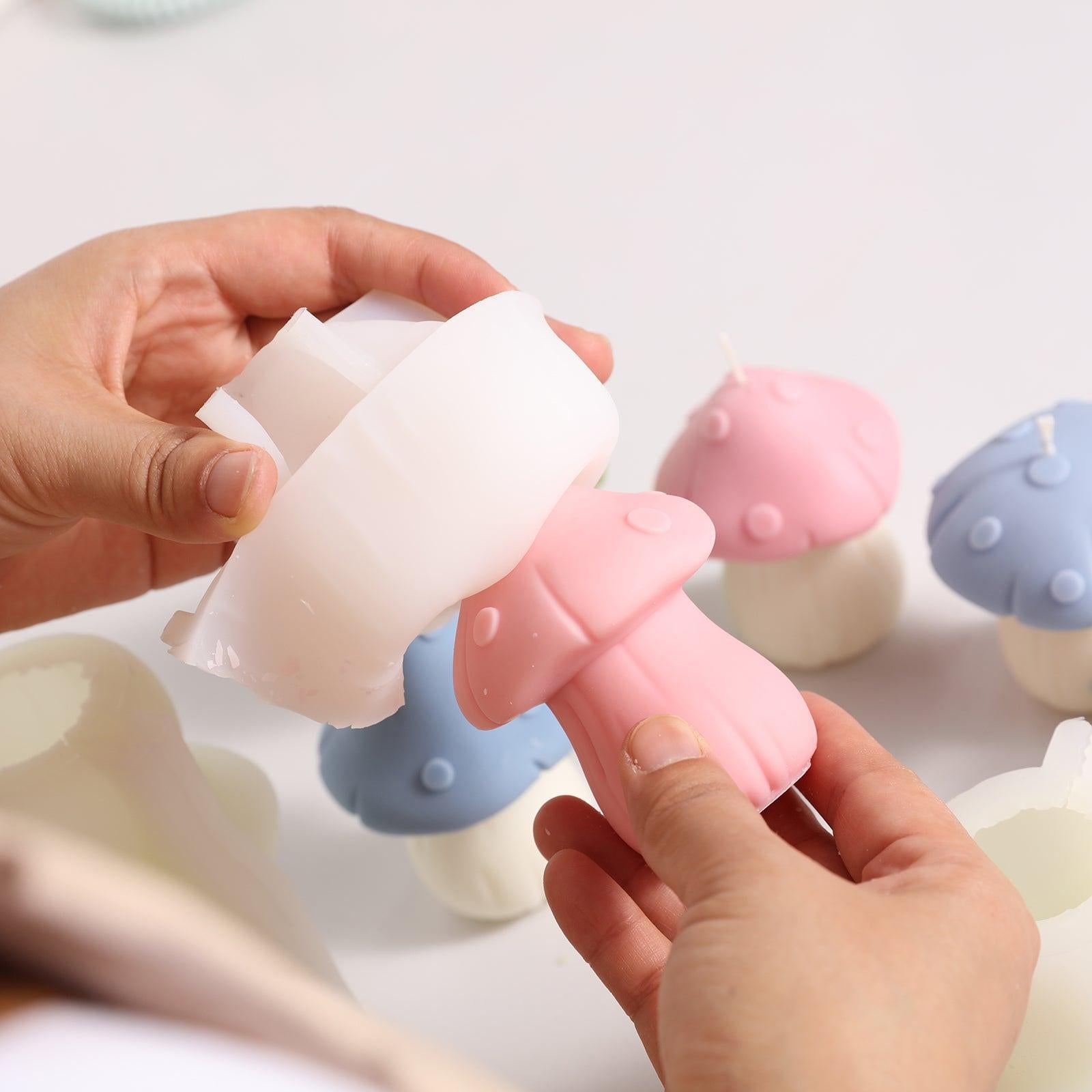 Pink mushroom-shaped candles emerge from silicone molds, designed by Boowan Nicole.