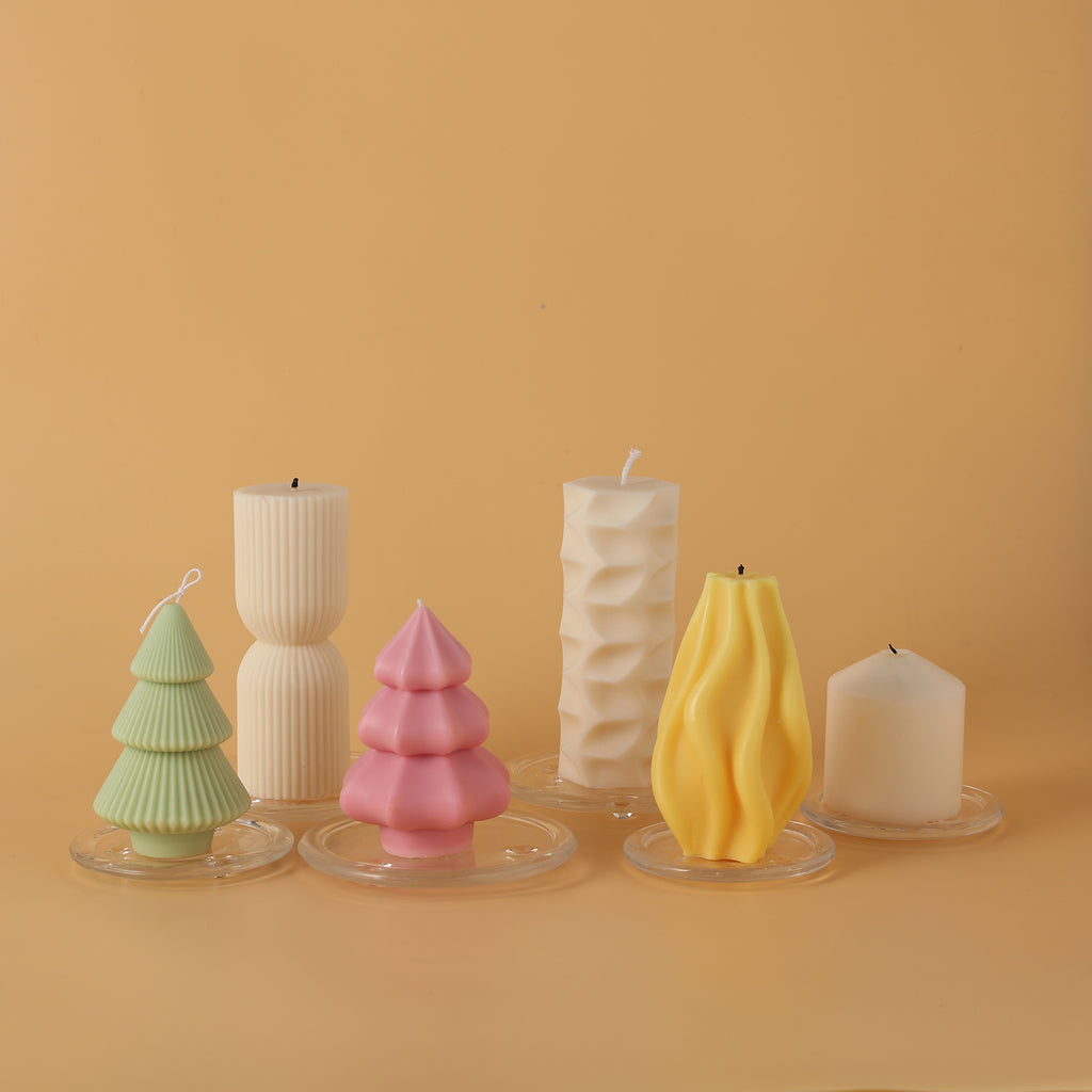 Candles of various shapes are placed on glass trays for a wide range of uses - Boowan Nicole