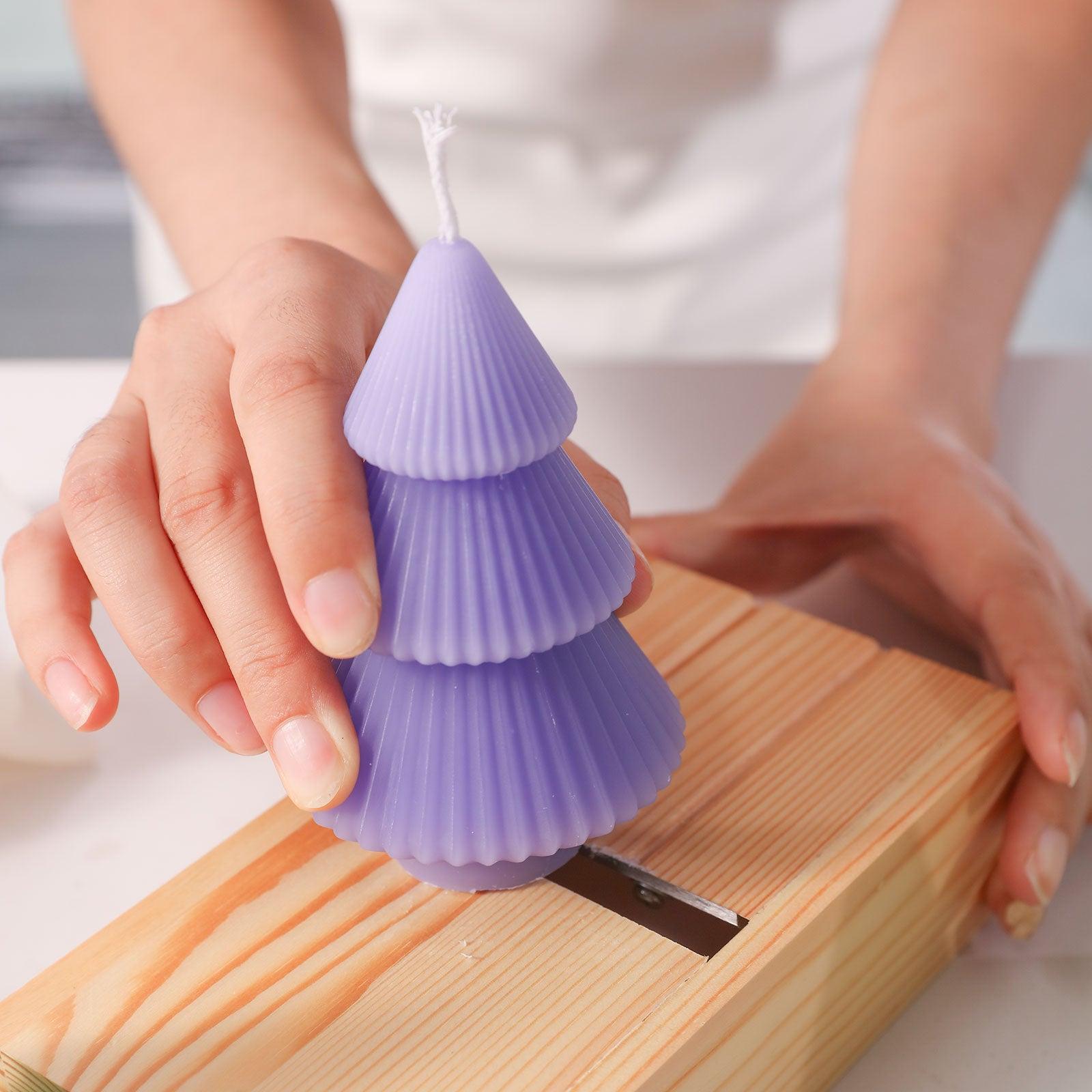 Use tools to polish the base of tower Christmas tree candles - Boowan Nicole