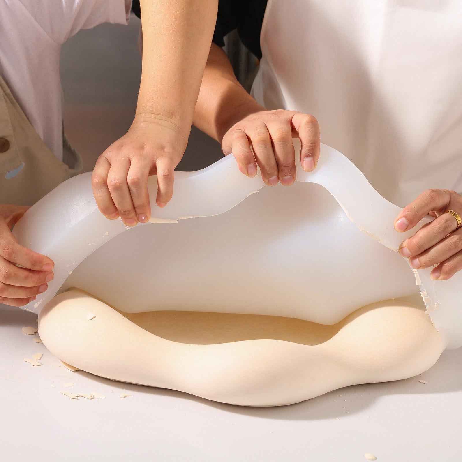 The completed large flower tray comes out of the silicone mold.