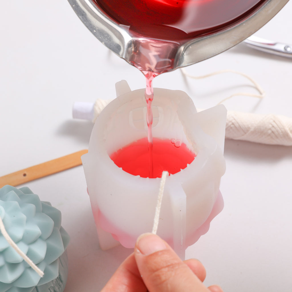 Pour the red wax liquid into the white silicone mold-Boowan Nicole