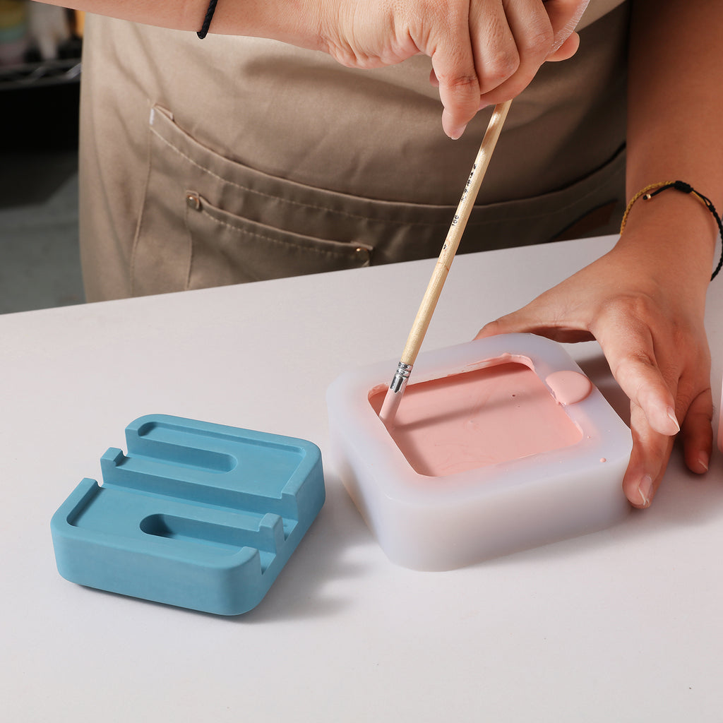 Use a brush to remove air bubbles from silicone molds used to make Square Multi-Functional Stationery Support - Boowan Nicole
