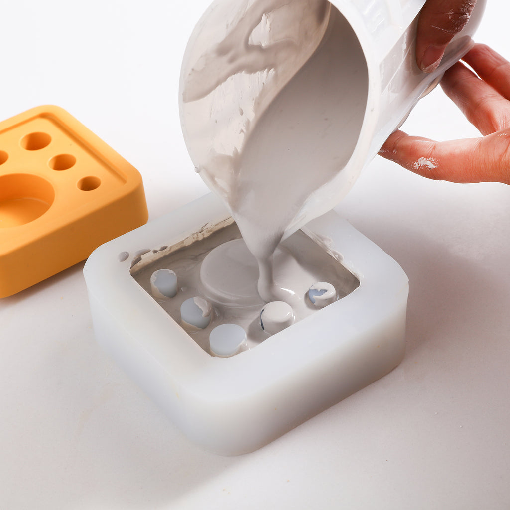 Pour gray boowannite into silicone mold to make Square Multi-Functional Stationery Support - Boowan Nicole