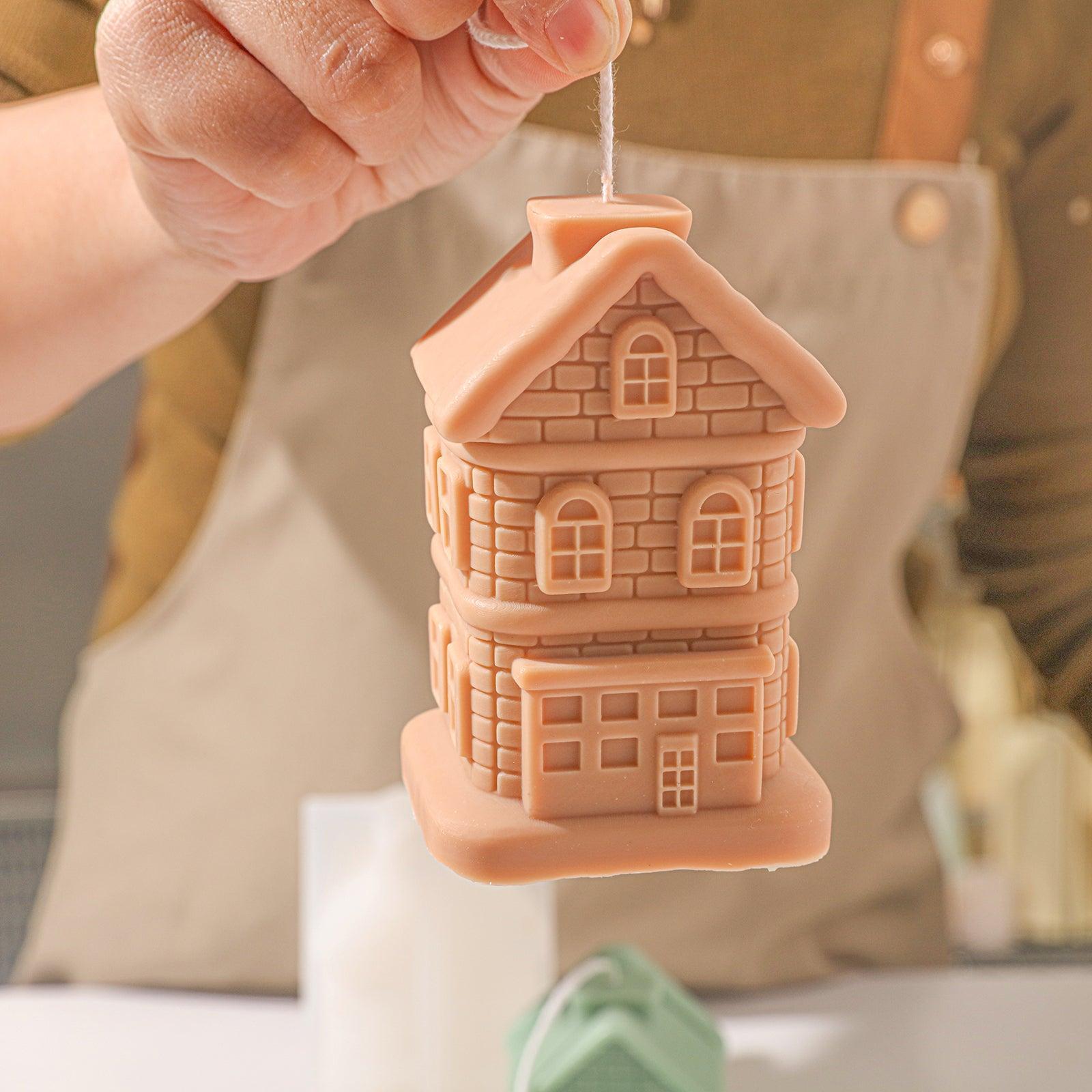 Handheld light brown house candle display, designed by Boowan Nicole.