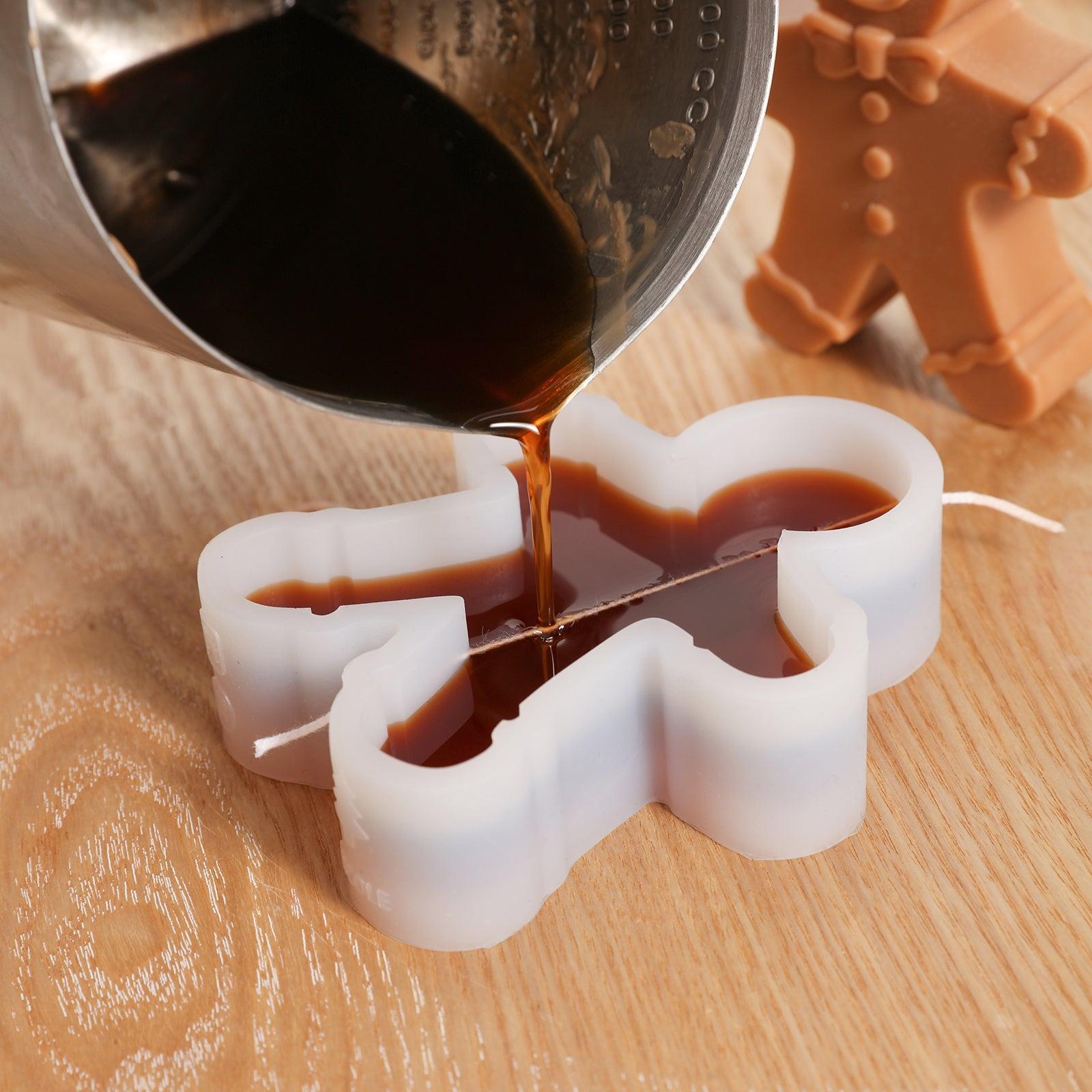 Pour brown wax liquid into white silicone mold to make Gingerbread Papa Candle-Boowan Nicole