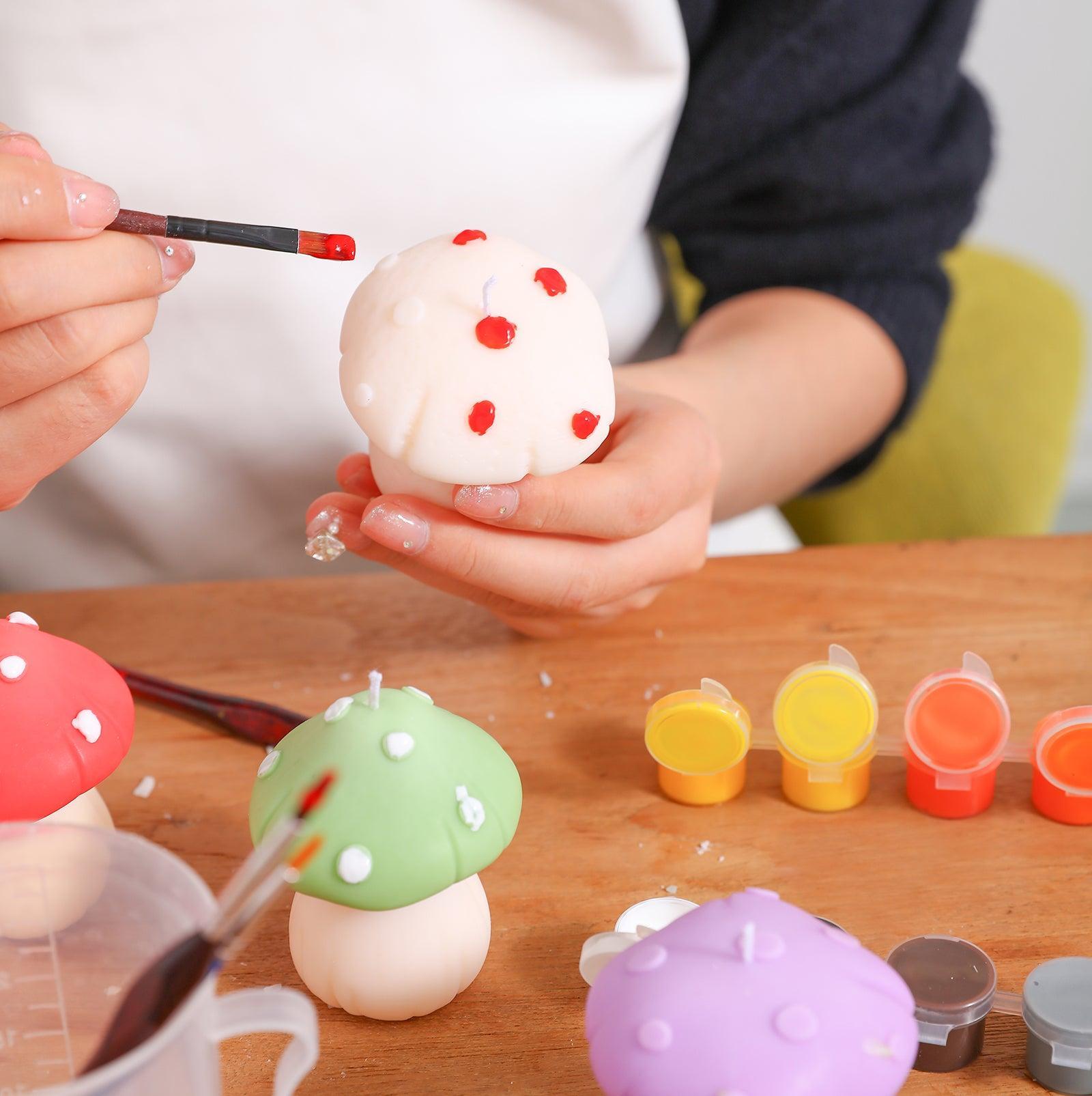 Paint red on a white mushroom-shaped candle, designed by Boowan Nicole.