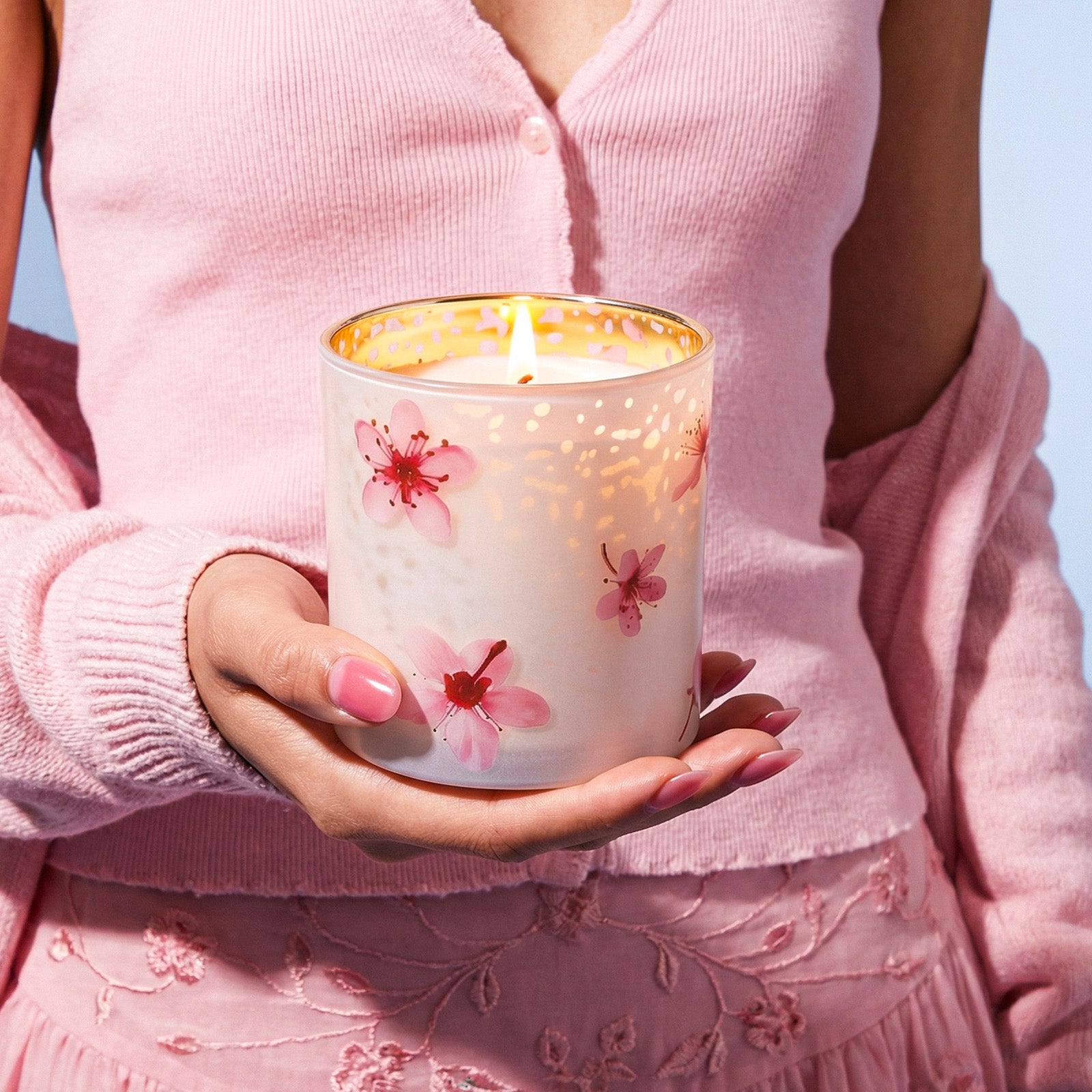 Hand Holding Lit Pink Cherry Blossom Printed Gold Electroplated Frosted Glass Candle Jar - Boowan Nicole