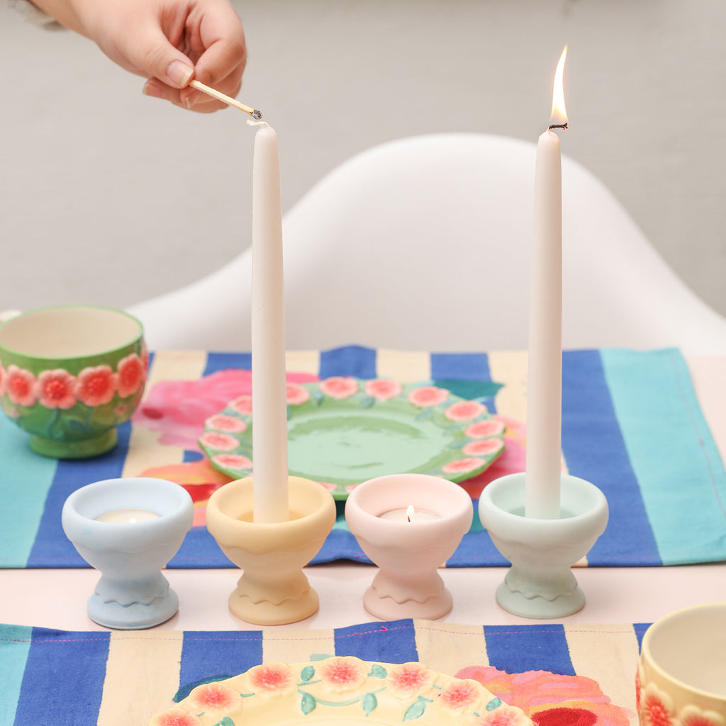  Illuminate your space as tapered candles are elegantly lit and placed on the Eggshell Cup Shape Candle Holder.