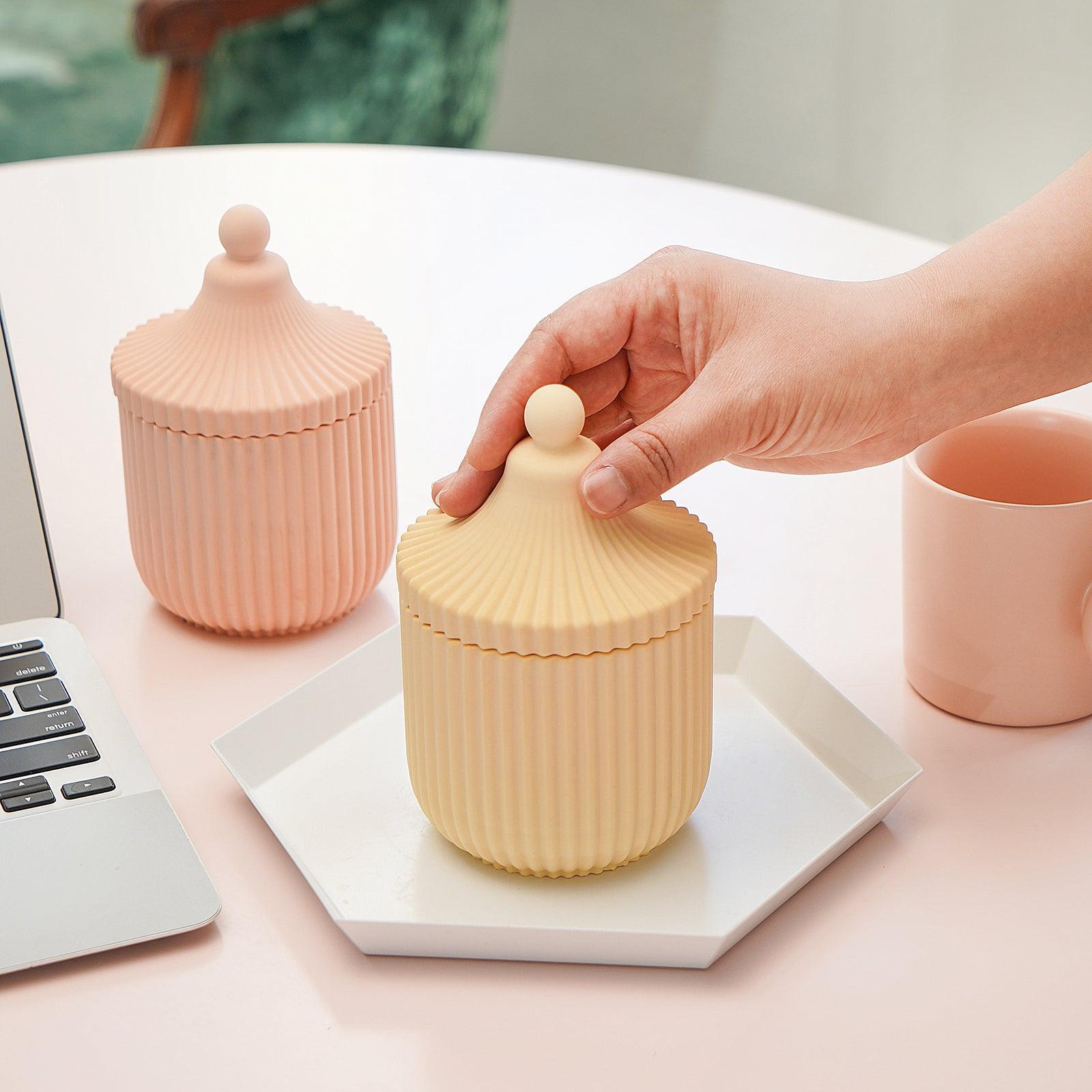 Place a candle jar in a tray next to your computer. The lighted flame can dispel the stress and fatigue of work.