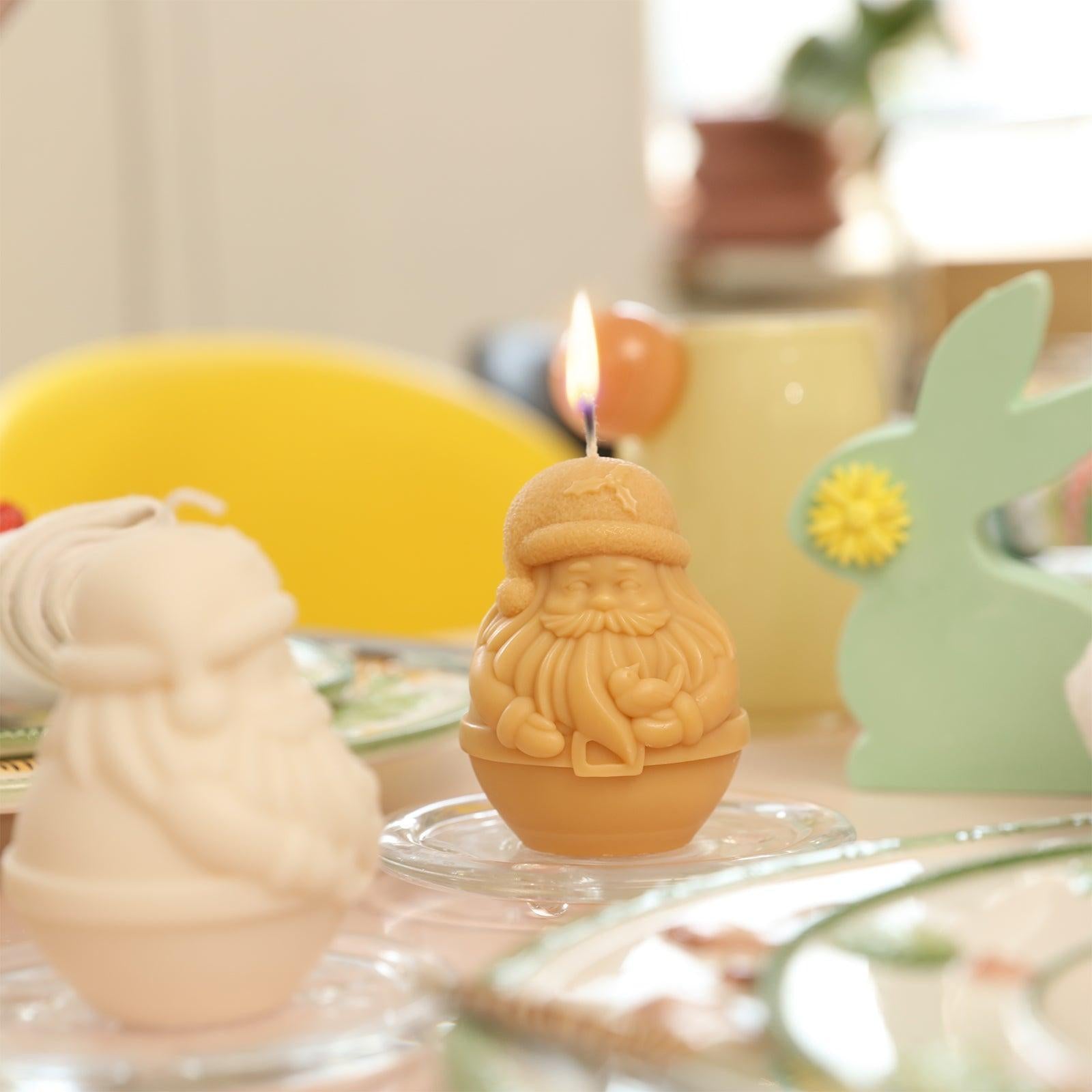 Light the yellow Santa Claus Candle on the table-Boowan Nicole