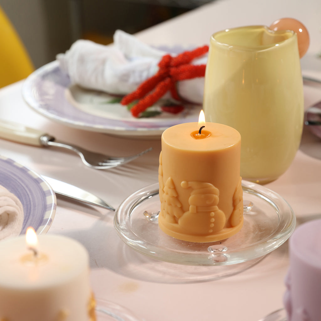 Christmas snowman relief pillar candle burning on crystal tray for dining table - Boowan Nicole