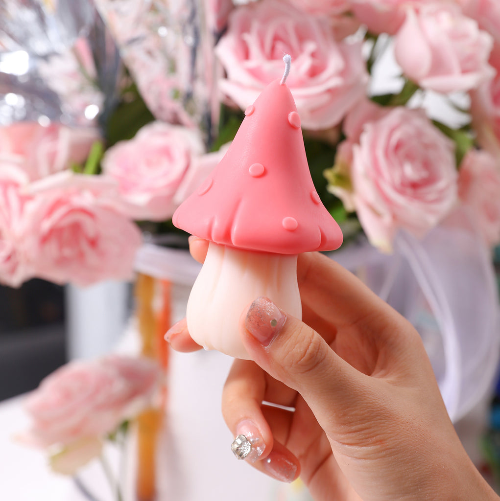 The pink candle with white handle is held with fingers, and the mold is exquisitely crafted to bring the beauty of the work, designed by Boowan Nicole.