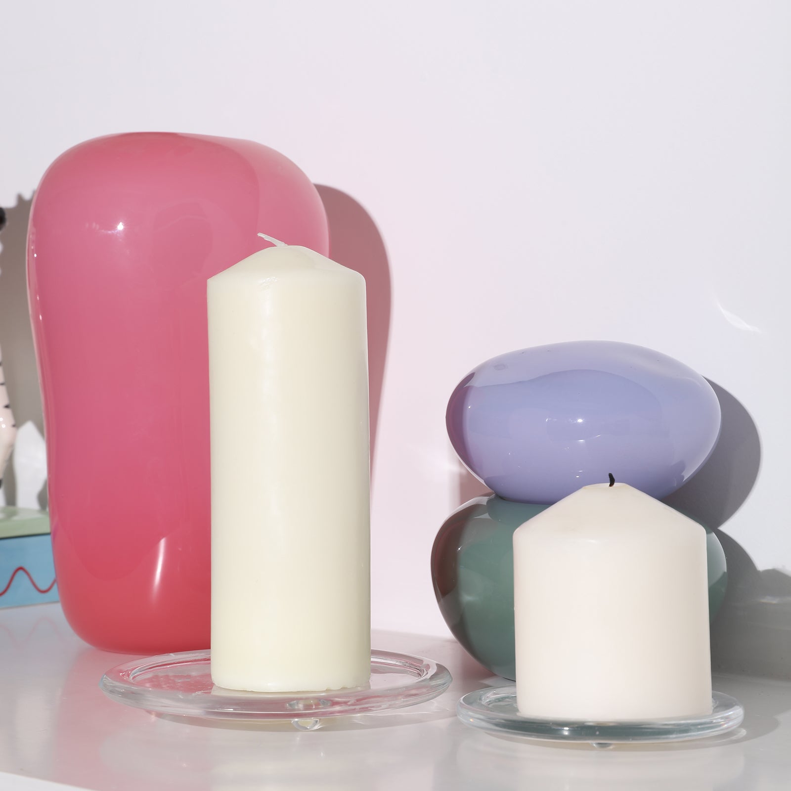 Two white pillar candles placed on a glass tray - Boowan Nicole