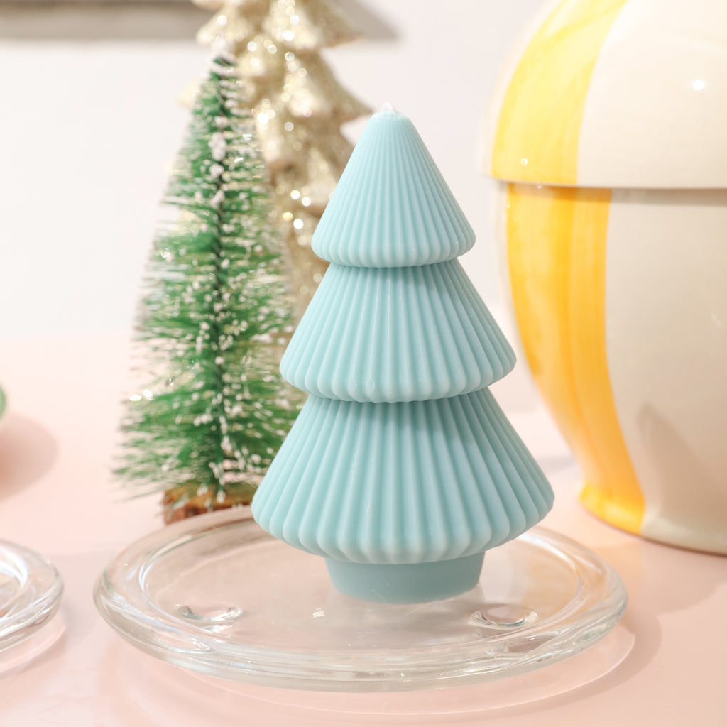 Light blue tower-shaped Christmas tree candles placed on tabletop crystal tray - Boowan Nicole