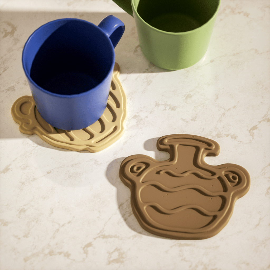 Coasters fit the shape of cups and decorate dining tables and desks, designed by Boowan Nicole.