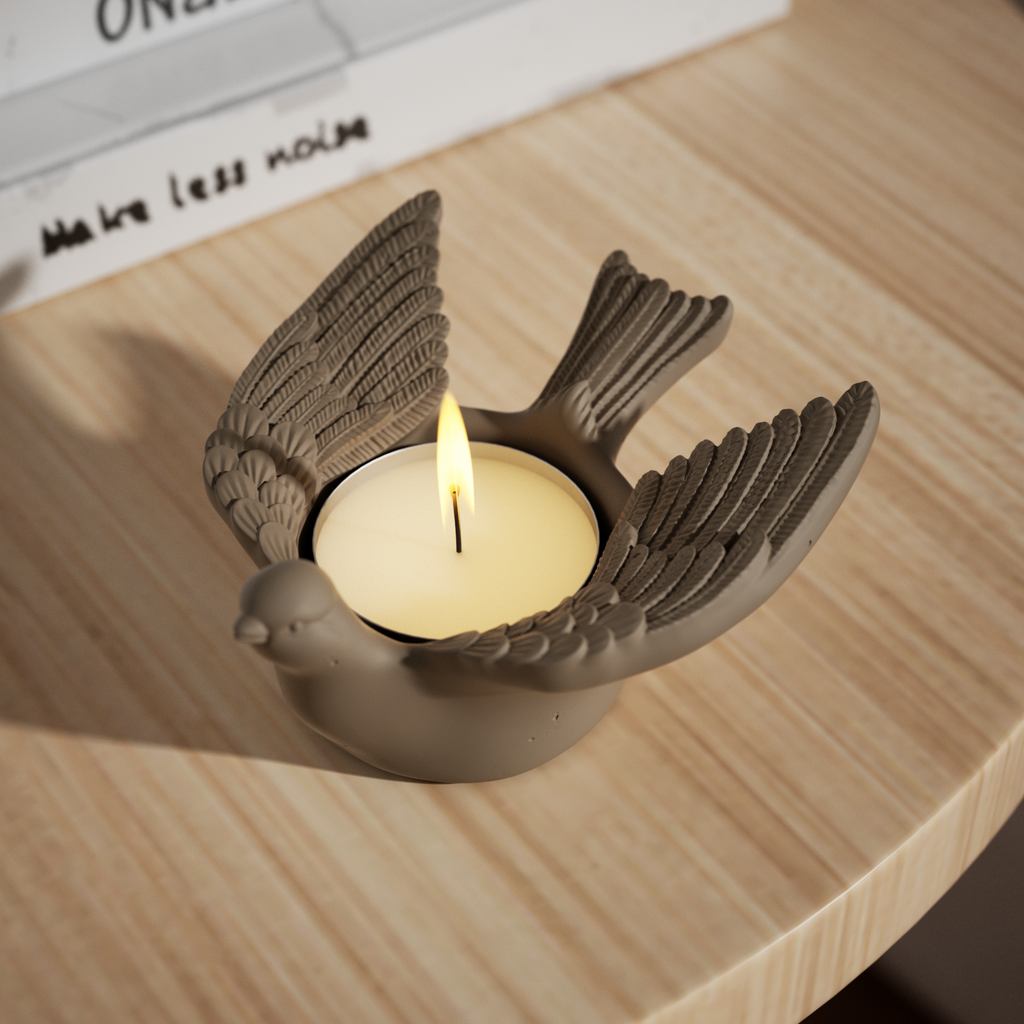 Lighting the candle inside a golden Joyful Bliss Bird Tealight Candle Holder.