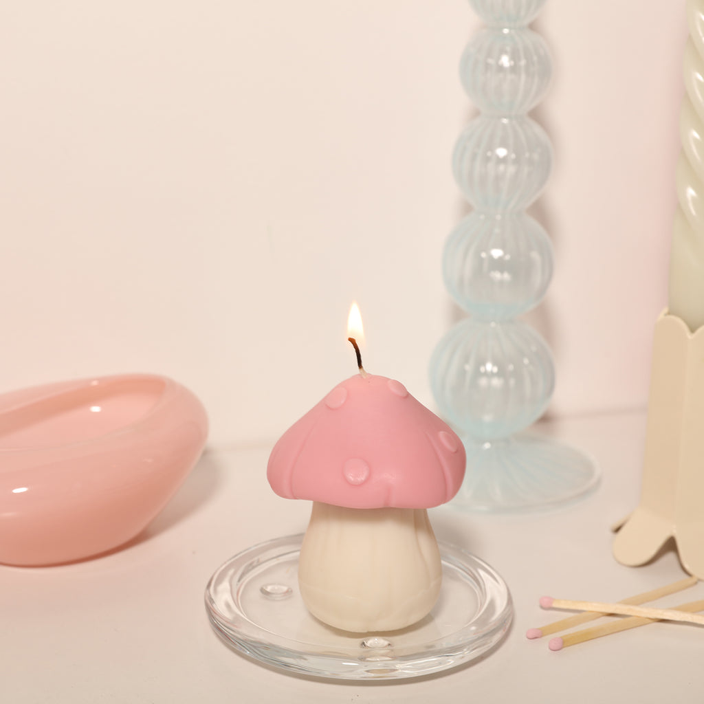 Light the pink fungus mushroom-shaped candle in a crystal tray, designed by Boowan Nicole.