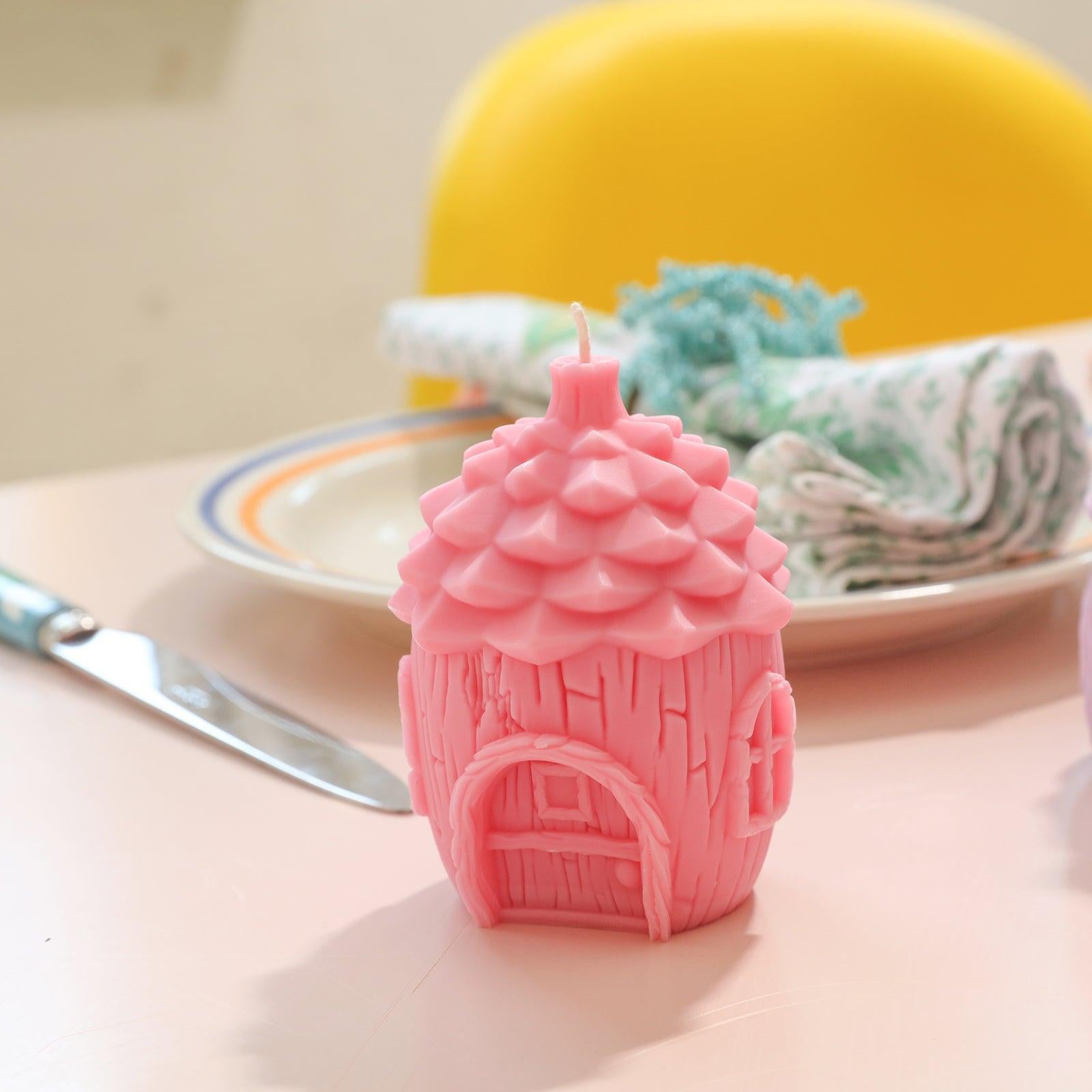Pink miniature fairy house candle placed on the dining table-Boowan Nicole
