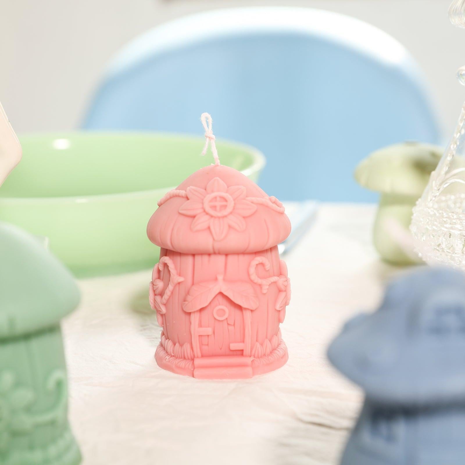Pink Miniature Mushroom House Candle on tabletop -Boowan Nicole