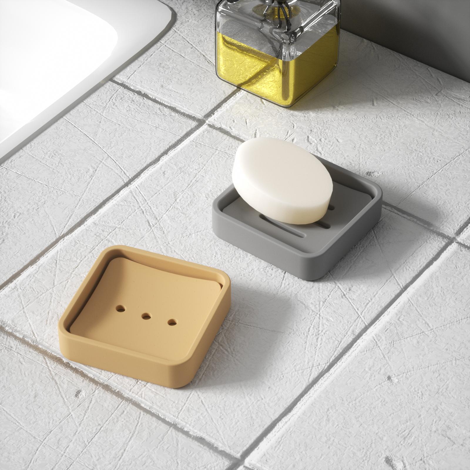 Gray and yellow soap boxes by the sink, with a soap bar on the gray box.